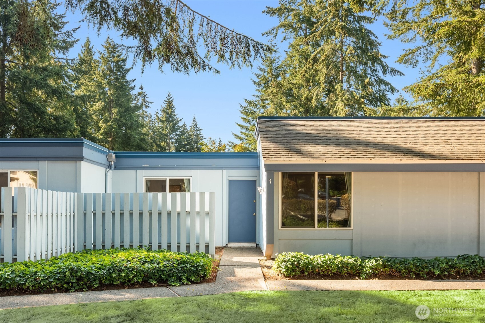4308 Northeast Sunset Boulevard, Unit X7 Renton, WA 98059 - Photo 2 of 17 front view of a house with a small yard