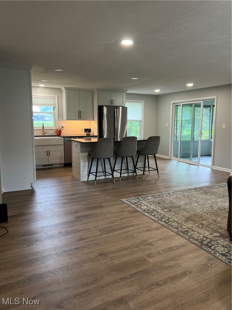 232 Hoffman Road Loudonville, OH 44842 - Photo 6 of 28 Dining area with a textured ceiling, recessed lighting, and dark wood-style flooring