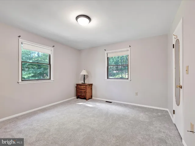a bathroom with a sink a toilet and vanity