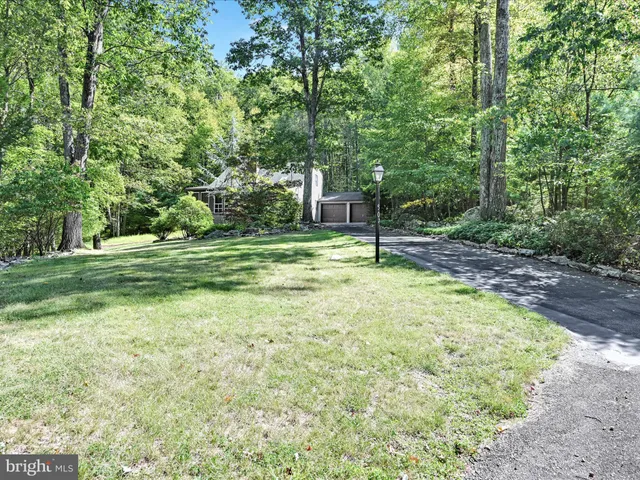 a house with a trees in the background