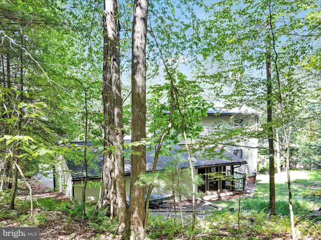 a balcony with lots of green space and plants