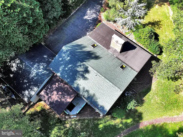 an aerial view of house with yard