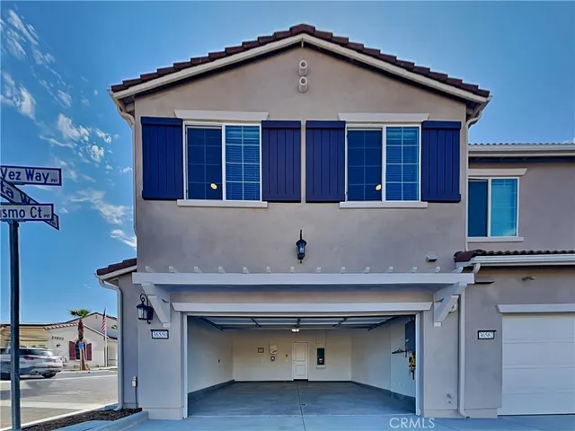 a view of kitchen with stainless steel appliances granite countertop a sink and cabinets