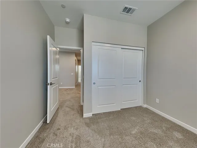 wooden floor and closet in a room