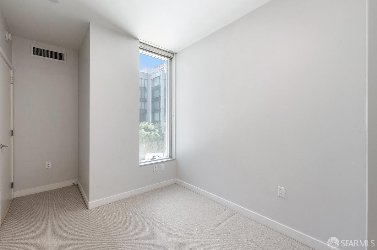 333 Main Street, Unit 4M San Francisco, CA 94105 - Photo 12 of 39 an empty room with windows and closet