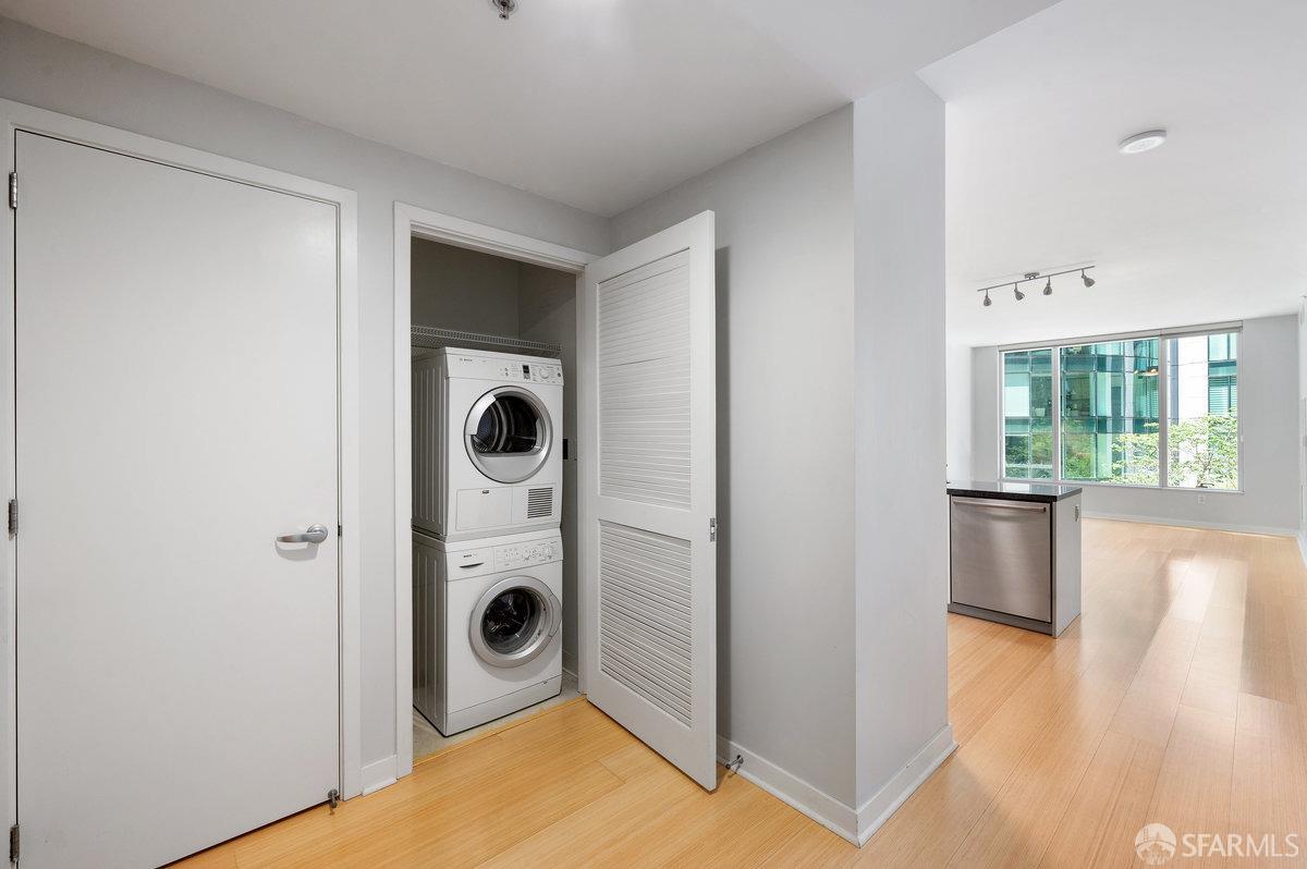 333 Main Street, Unit 4M San Francisco, CA 94105 - Photo 13 of 39 a view of a hallway to a room with wooden floor and bathroom