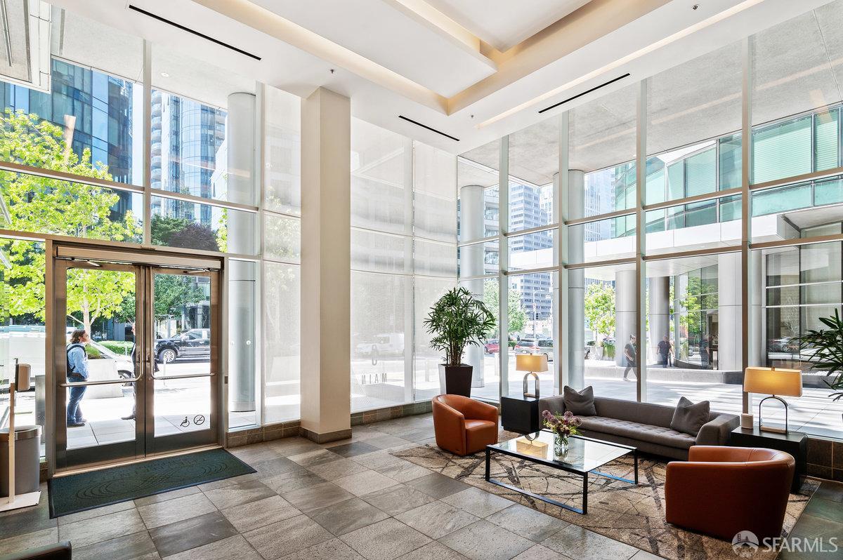 333 Main Street, Unit 4M San Francisco, CA 94105 - Photo 23 of 39 a living room with furniture and a floor to ceiling window