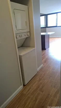 wooden floor in a living room next to a window