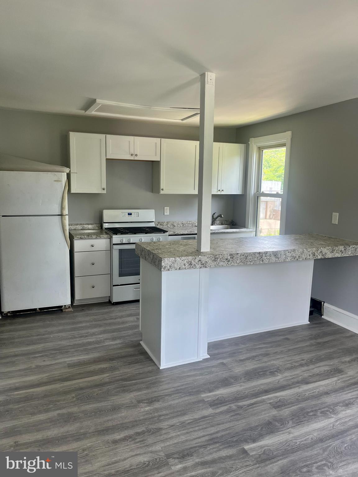2 Beloit Avenue, Unit B Audubon, NJ 08106 - Photo 4 of 10 a kitchen with granite countertop a stove and a sink
