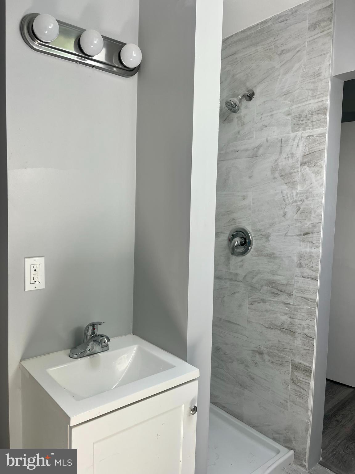 2 Beloit Avenue, Unit B Audubon, NJ 08106 - Photo 6 of 10 a bathroom with a sink a toilet and shower