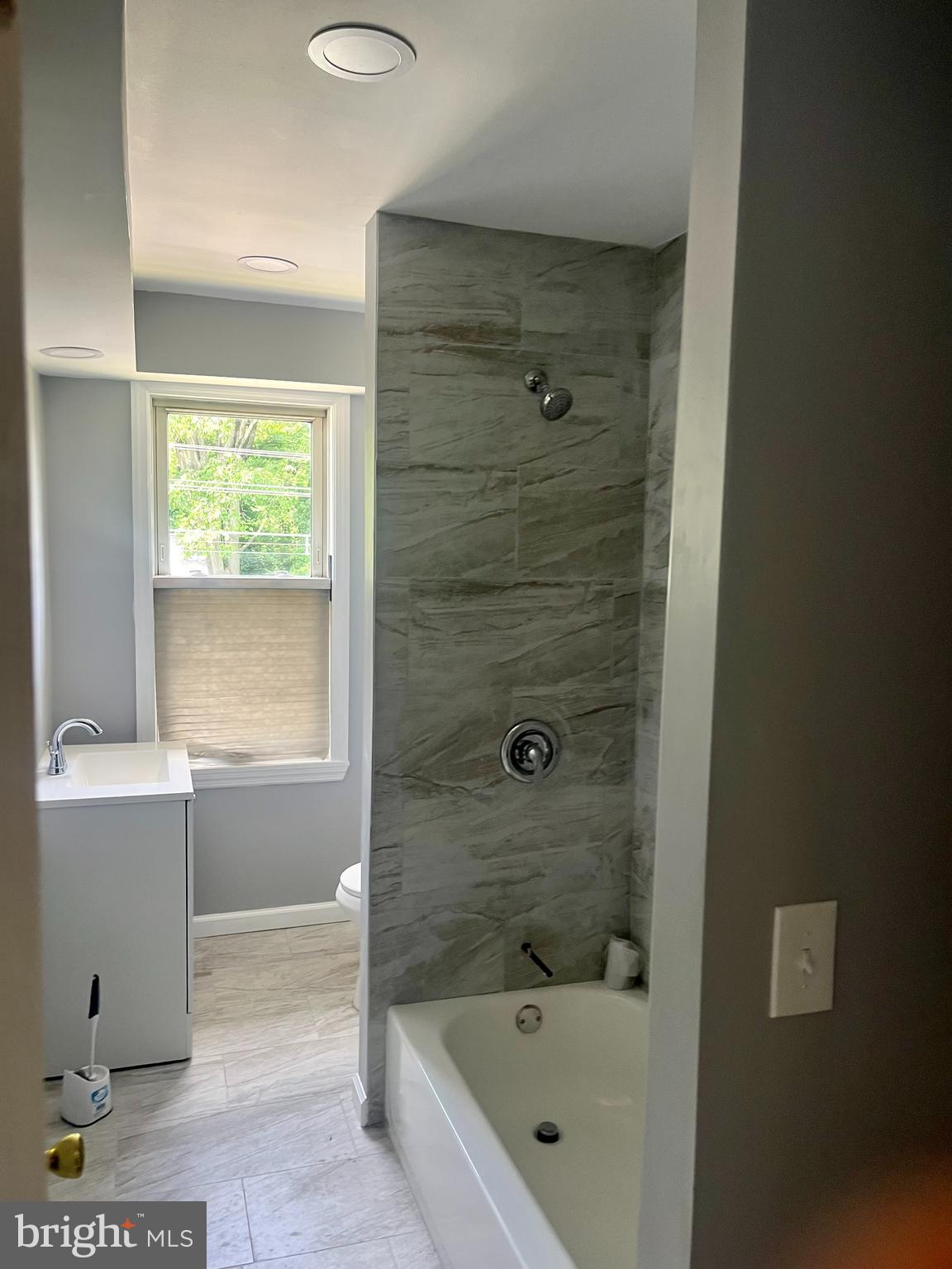 2 Beloit Avenue, Unit B Audubon, NJ 08106 - Photo 7 of 10 a bathroom with a bathtub and shower