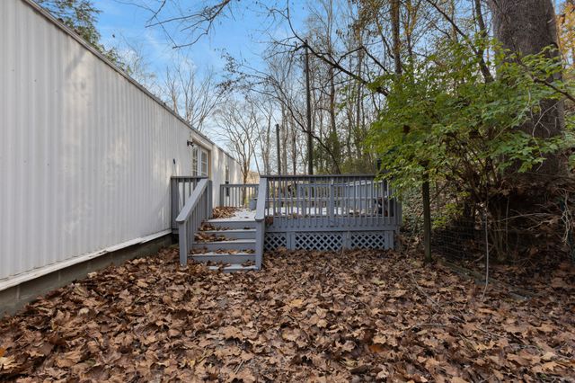 a view of a bench in a backyard