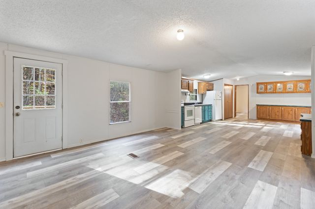 a view of an empty room with a window