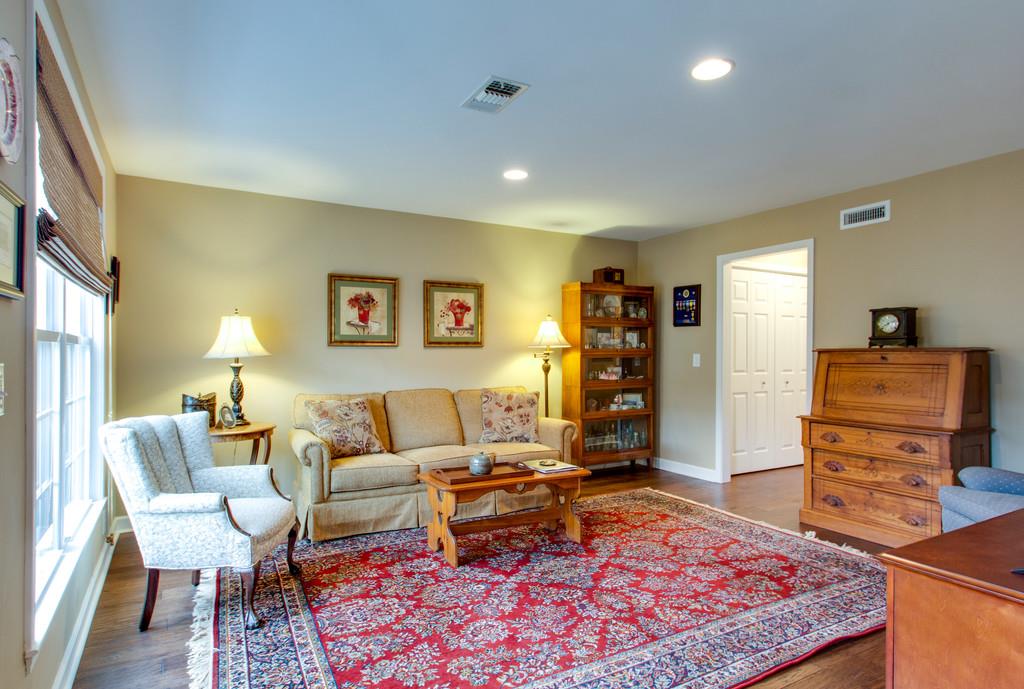 1323 General George Patton Road Nashville, TN 37221 - Photo 12 of 30 a living room with furniture and wooden floor