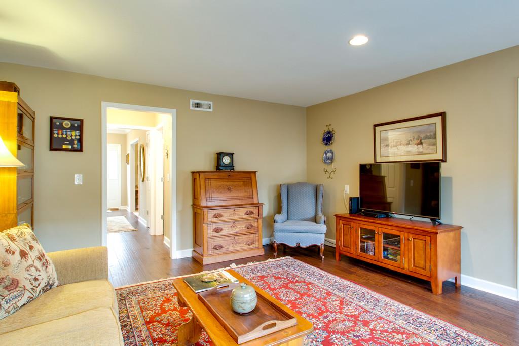 1323 General George Patton Road Nashville, TN 37221 - Photo 13 of 30 a bedroom with furniture and a flat screen tv