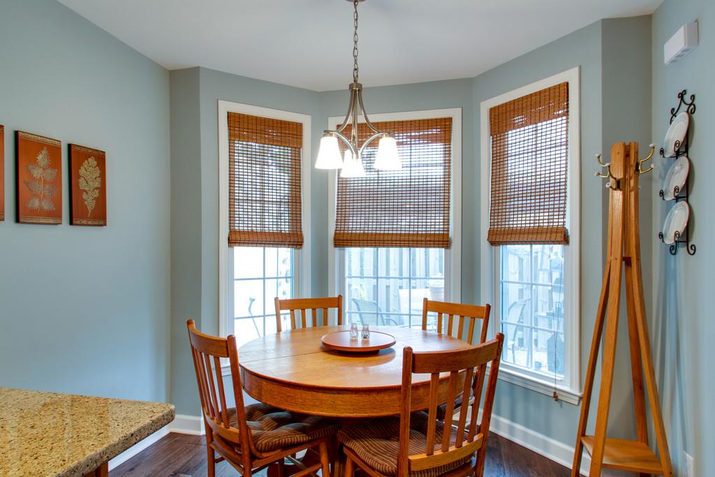 1323 General George Patton Road Nashville, TN 37221 - Photo 18 of 30 a dining room with furniture a chandelier and wooden floor