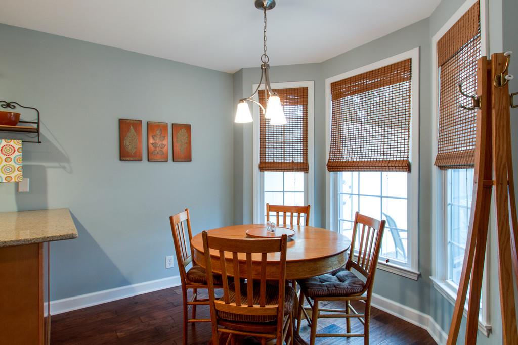 1323 General George Patton Road Nashville, TN 37221 - Photo 19 of 30 a view of a dining room with furniture window and wooden floor