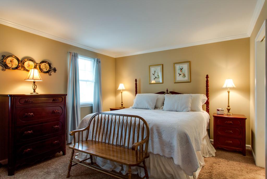 1323 General George Patton Road Nashville, TN 37221 - Photo 21 of 30 a bedroom with a bed and a night stand