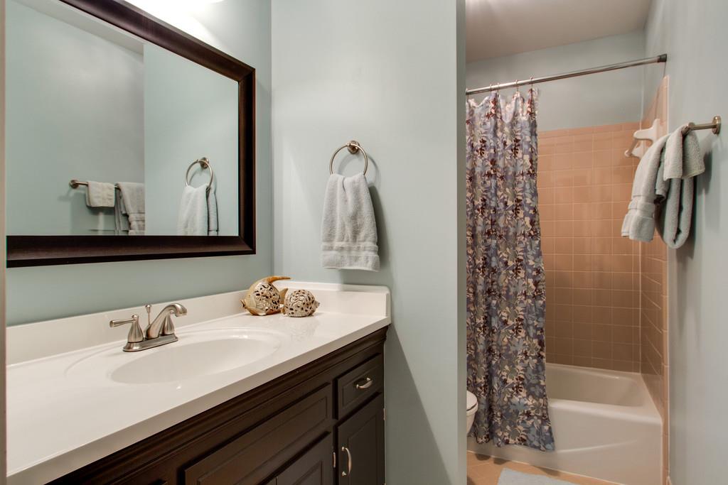 1323 General George Patton Road Nashville, TN 37221 - Photo 26 of 30 a bathroom with a sink and a mirror