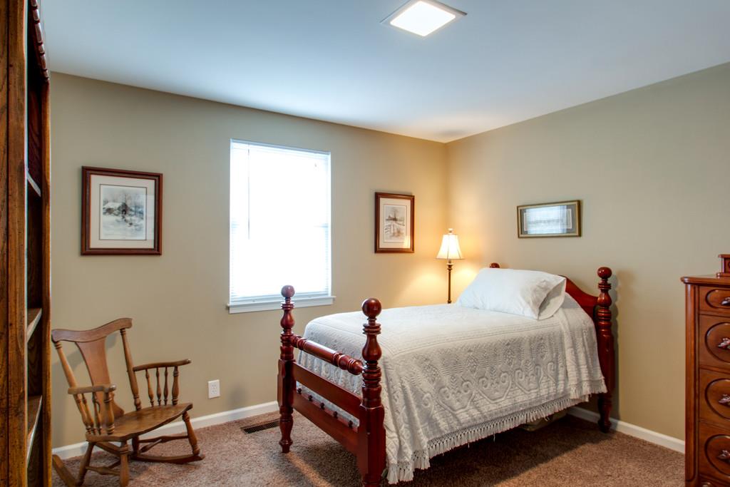 1323 General George Patton Road Nashville, TN 37221 - Photo 27 of 30 a bedroom with bed and a window