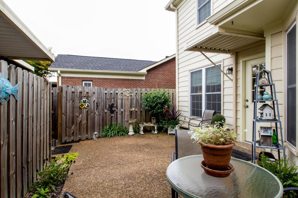 1323 General George Patton Road Nashville, TN 37221 - Photo 29 of 30 a view of a house with porch and garden