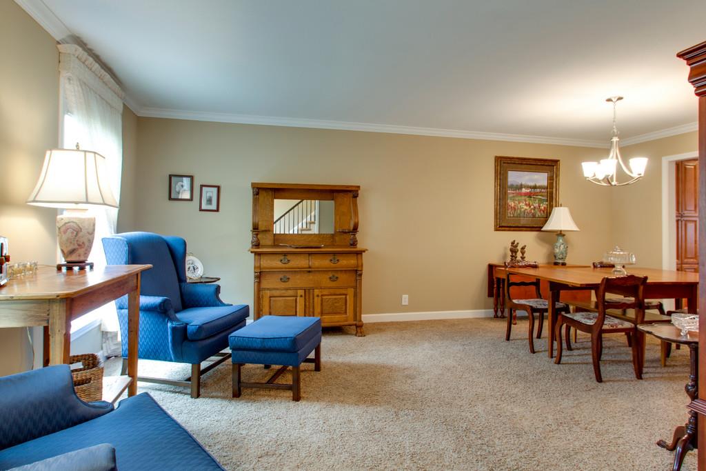 1323 General George Patton Road Nashville, TN 37221 - Photo 6 of 30 a living room with furniture a piano and a flat screen tv