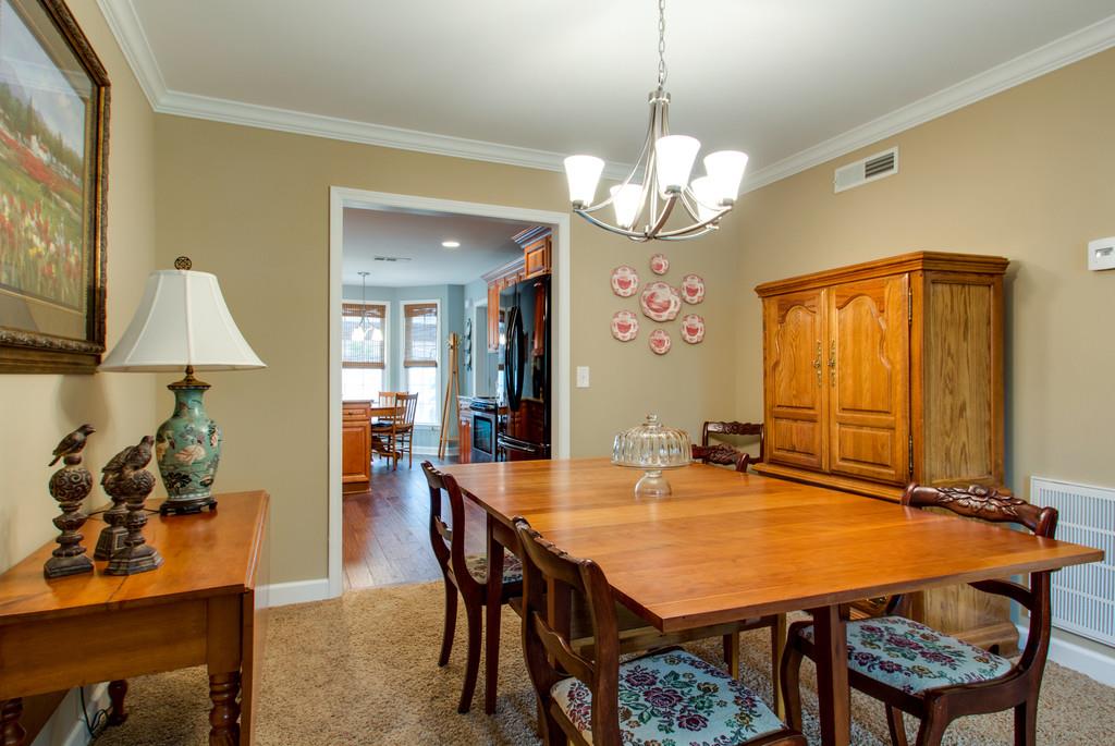 1323 General George Patton Road Nashville, TN 37221 - Photo 9 of 30 a view of a dining room with furniture and wooden floor