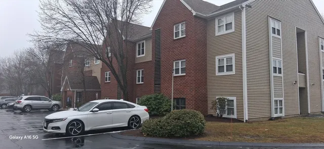 a view of a car park in front of a building
