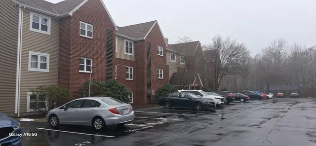 a view of a car parked in front of a building