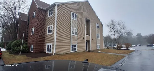 a view of a house with snow on the road