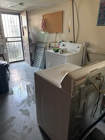 a room with water heater and wooden floor