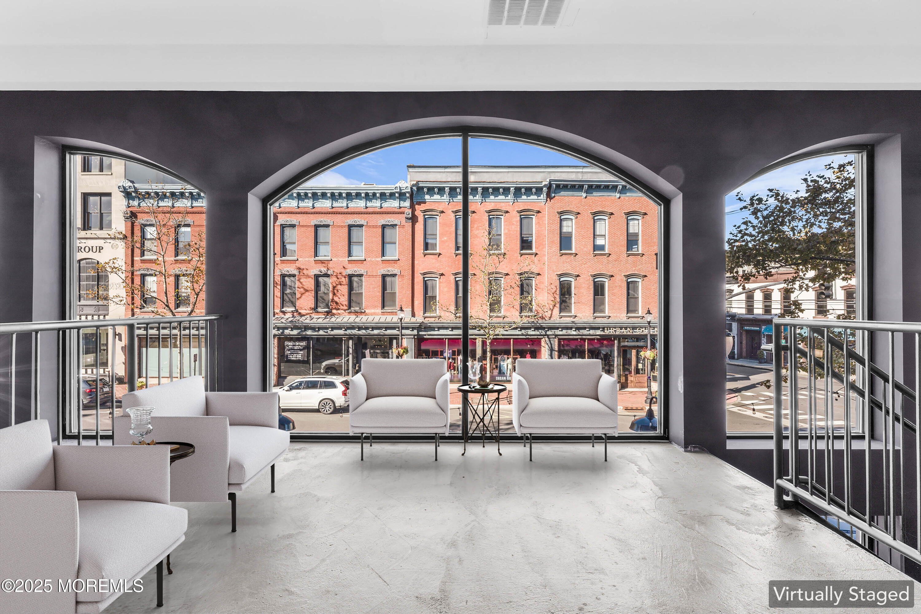 7 Broad Street, Unit 4 Red Bank, NJ 07701 - Photo 17 of 23 a living room with furniture and floor to ceiling windows