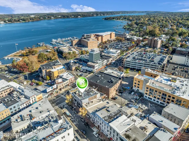 an aerial view of a house with a lake view