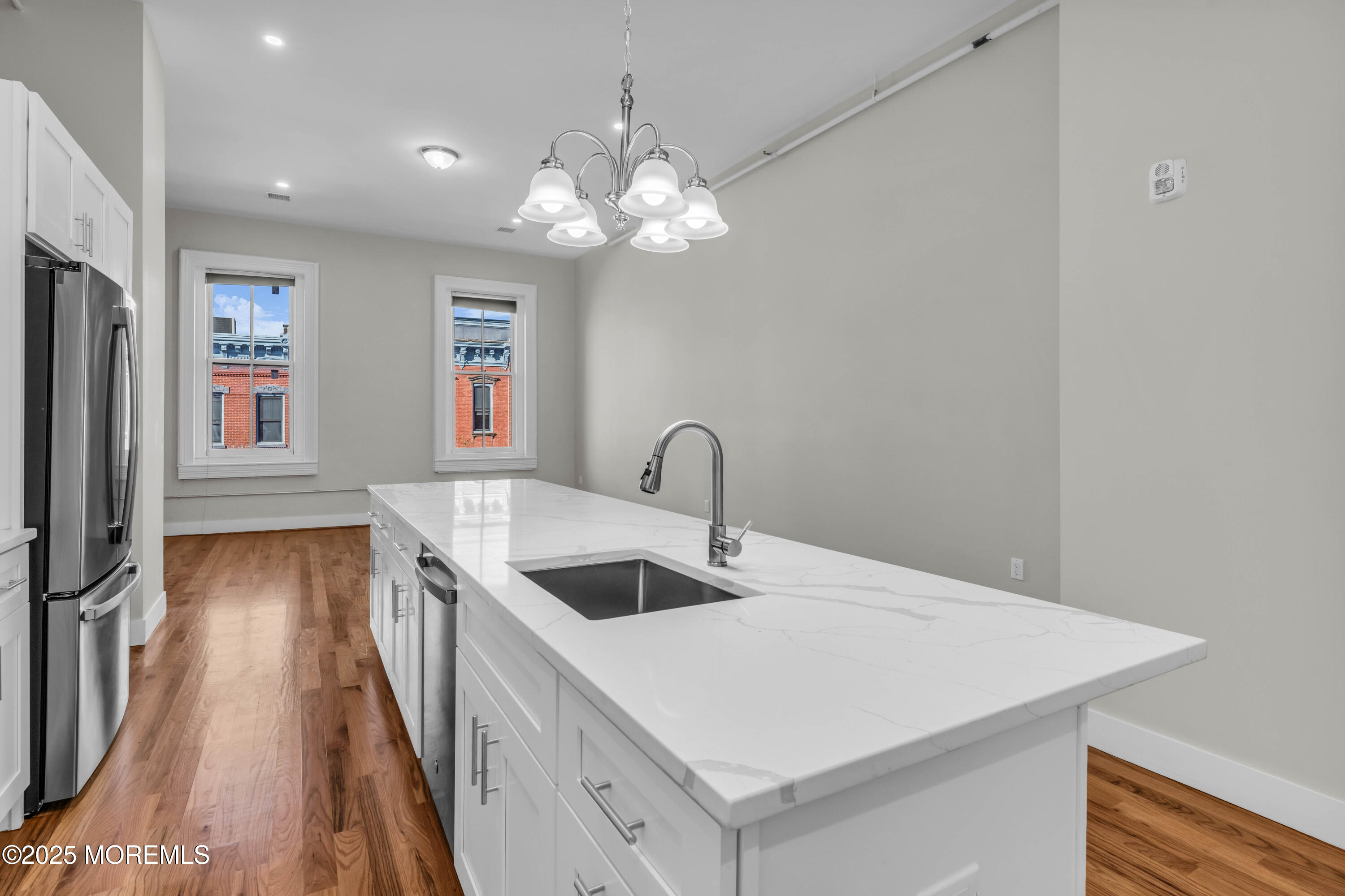 7 Broad Street, Unit 4 Red Bank, NJ 07701 - Photo 6 of 23 a view of a kitchen with a sink and dishwasher
