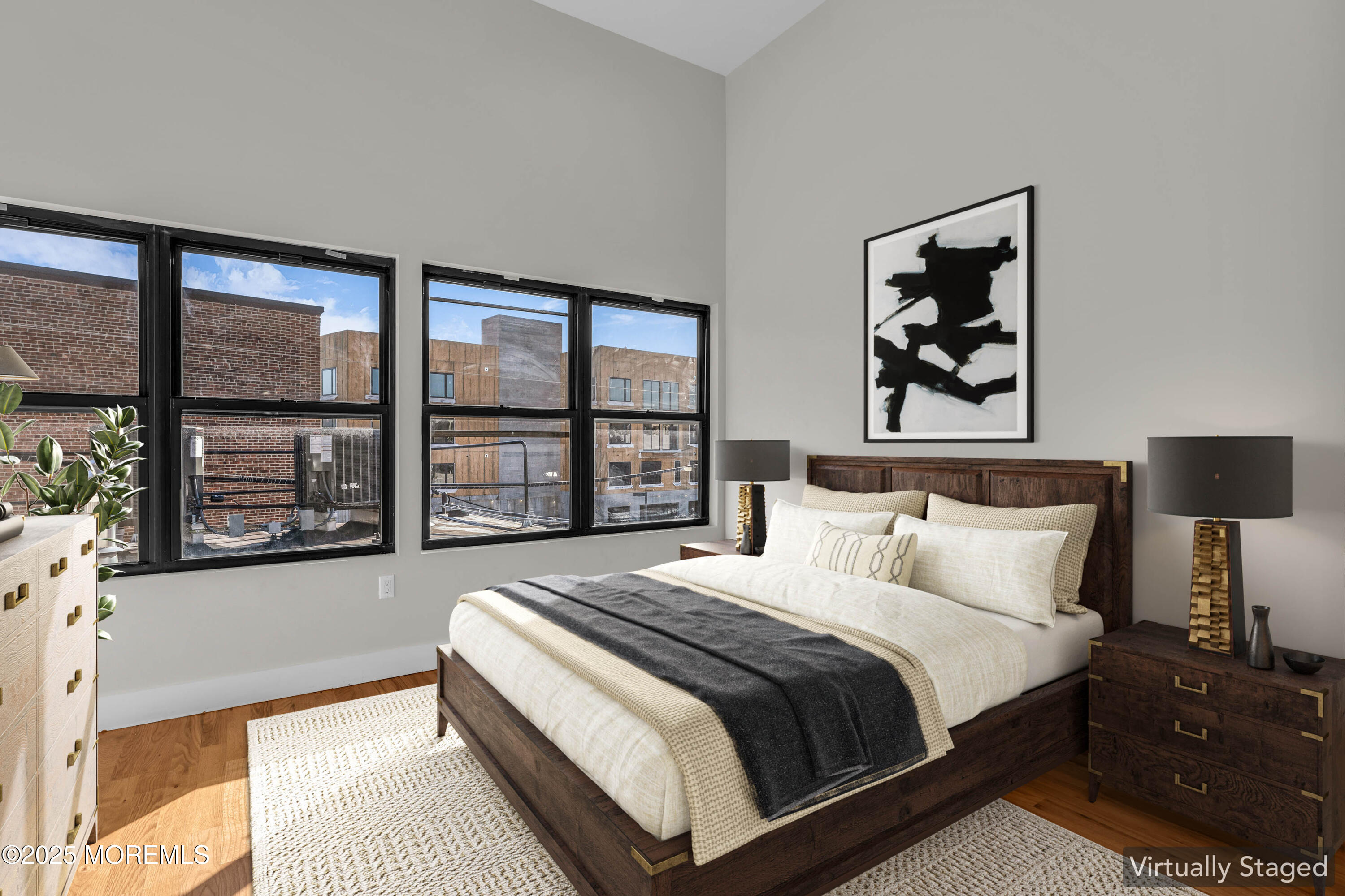 7 Broad Street, Unit 4 Red Bank, NJ 07701 - Photo 9 of 23 a bedroom with bed and a large window