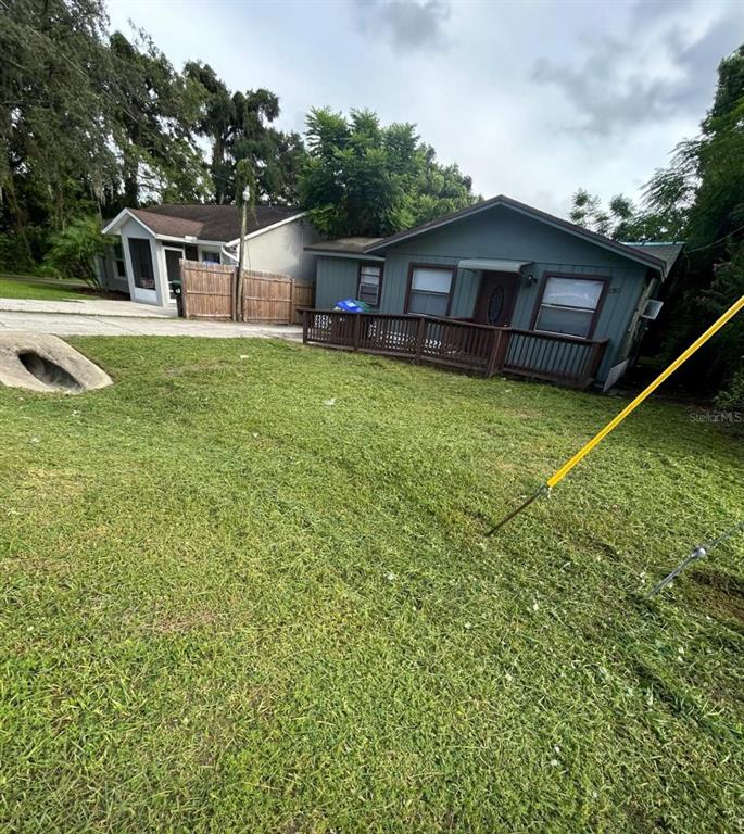 140 East 12th Street Apopka, FL 32703 - Photo 13 of 13 a view of a house with a backyard and a patio