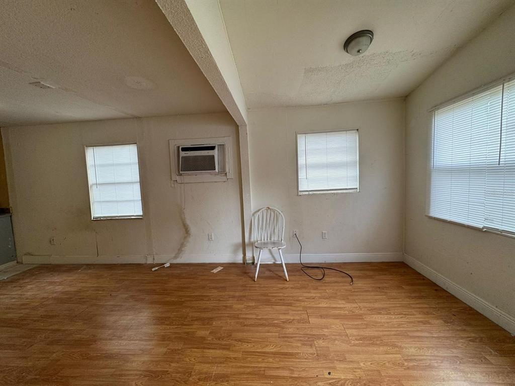 140 East 12th Street Apopka, FL 32703 - Photo 3 of 13 a view of wooden floor and windows in a room