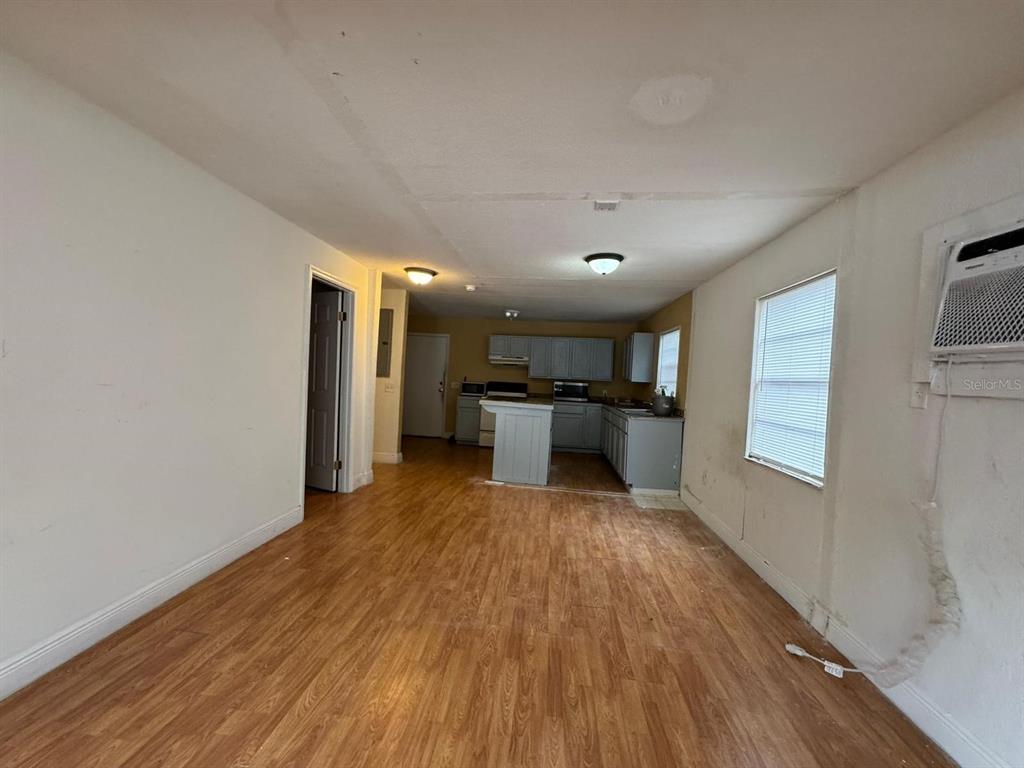 140 East 12th Street Apopka, FL 32703 - Photo 4 of 13 a view of kitchen with wooden floor