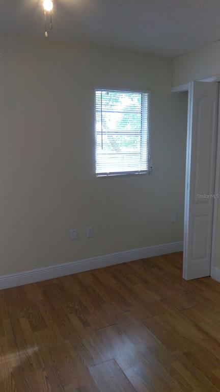 140 East 12th Street Apopka, FL 32703 - Photo 8 of 13 an empty room that has a window