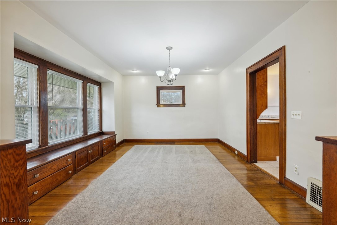 64 West Bagley Road Berea, OH 44017 - Photo 11 of 48 Dining room with a notable chandelier and hardwood / wood-style flooring