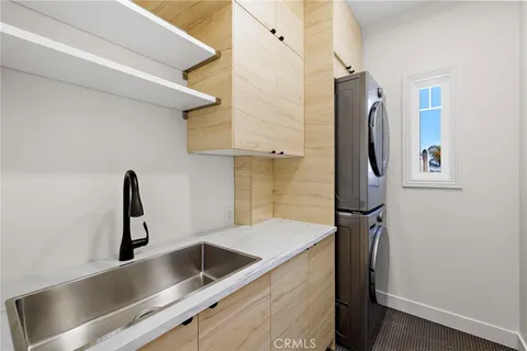 a kitchen with a refrigerator and a sink