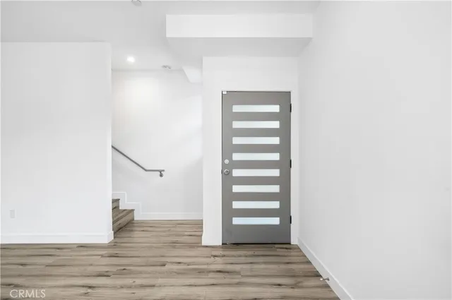 a view of entryway with wooden floor