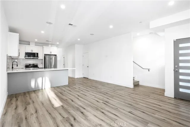 a view of kitchen view with wooden floor and window