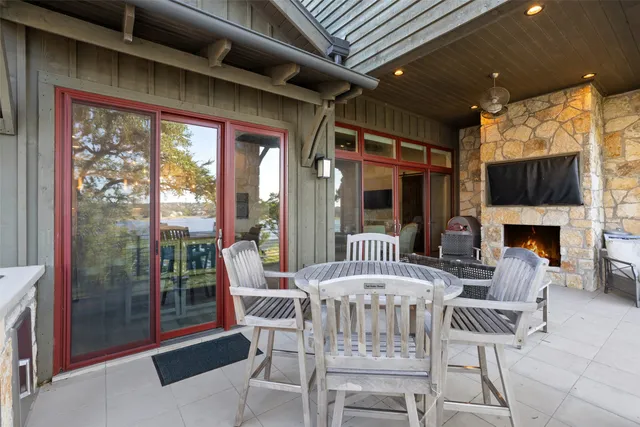 a outdoor space with the couches and a fireplace