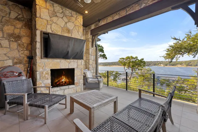 a view of a chairs and a table in the patio