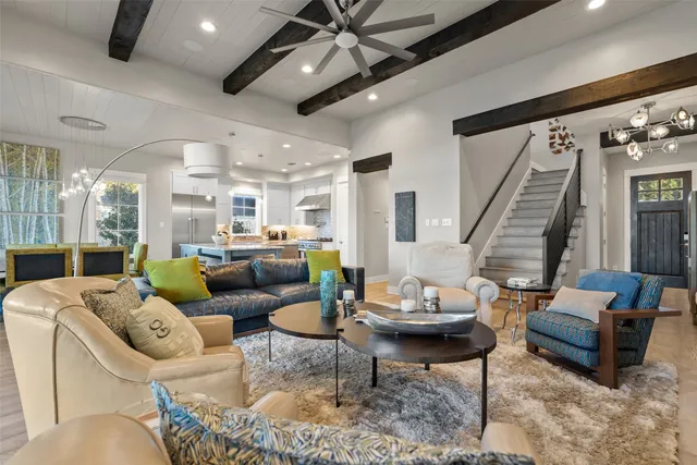 a kitchen with stainless steel appliances granite countertop a sink refrigerator and cabinets