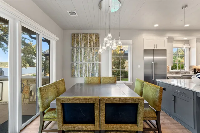 a kitchen with granite countertop a sink stainless steel appliances and cabinets