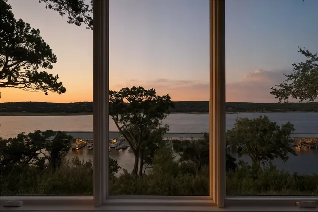 a bathroom with a double vanity sink mirror and bathtub