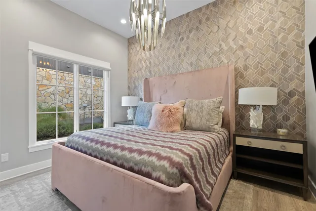 a bed room with a bed window and dresser