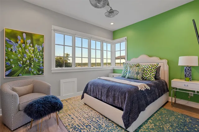 a bedroom with a bed and a couch